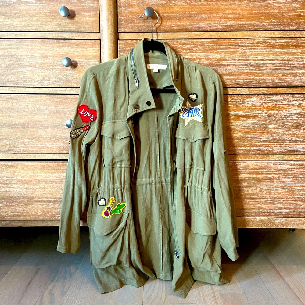 green jacket with patches